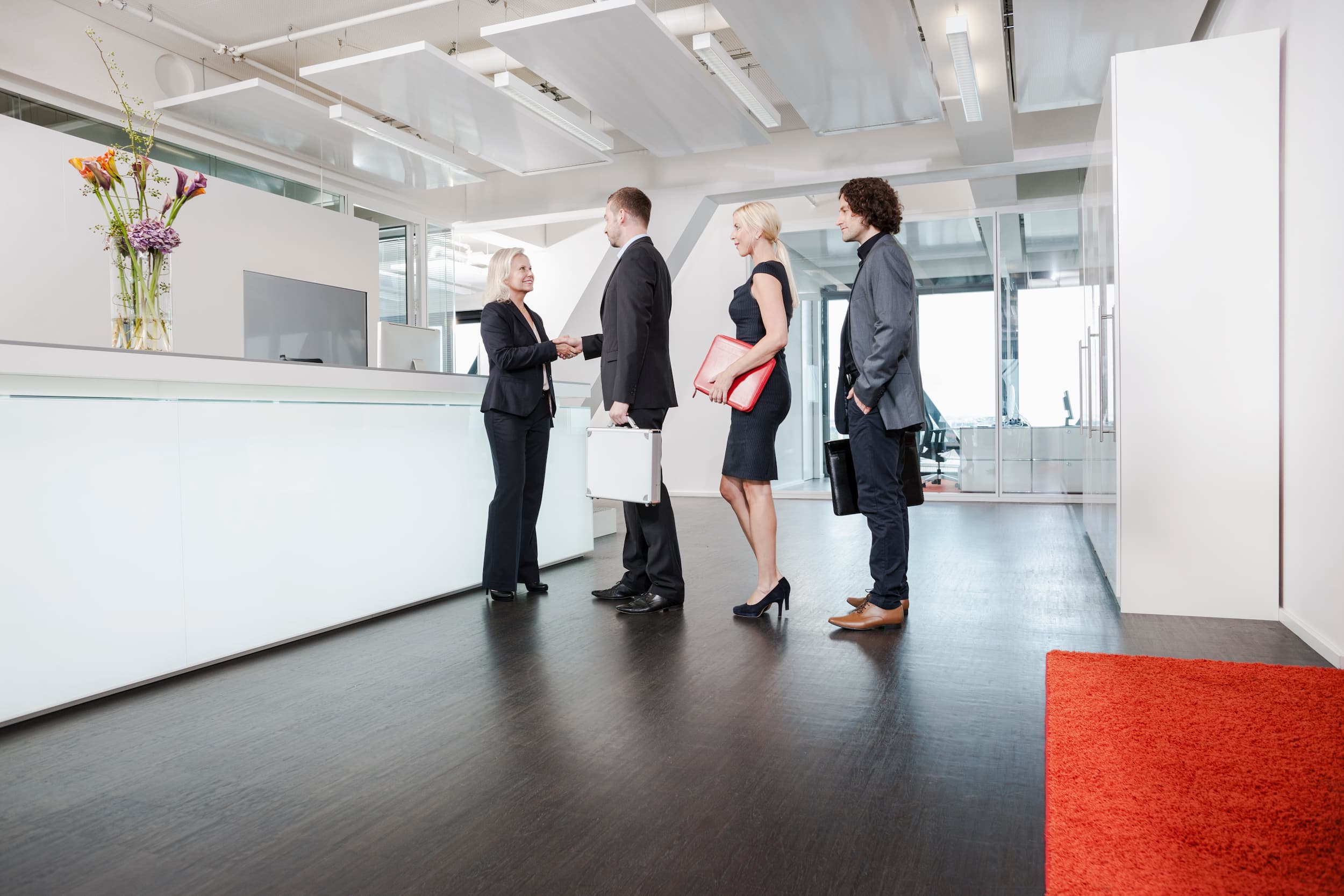 Business team greeted at office reception
